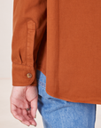 Sleeve close up of Oversize Overshirt in Burnt Terracotta worn by Alex