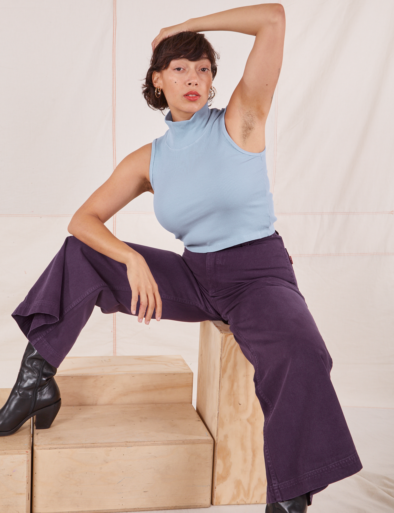Tiara is wearing Sleeveless Essential Turtleneck in Periwinkle and nebula purple Bell Bottoms