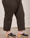 Pant leg side view of Petite Short Sleeve Jumpsuit in Espresso Brown worn by Ashley