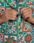 Close up of Anthony buttoning the Quilt Print Pantry Button-Up