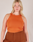 Lish is 5’8” and wearing L Racerback Tank in Sunset Orange