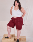 Ashley is 5'7" and wearing 1XL Railroad Carpenter Shorts in Mustang Red paired with a Cropped Tank in Vintage Tee Off-White
