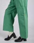 Side view pant leg close up of Drop Pocket Cargo Pants in Seafoam Green on Kira