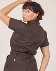 Angled back view close up of Short Sleeve Jumpsuit in Espresso Brown worn by Tiara