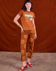 Alex is 5’8” and wearing P Vintage Tee in Orange Soda paired with Paintstamped Work Pants in Orange