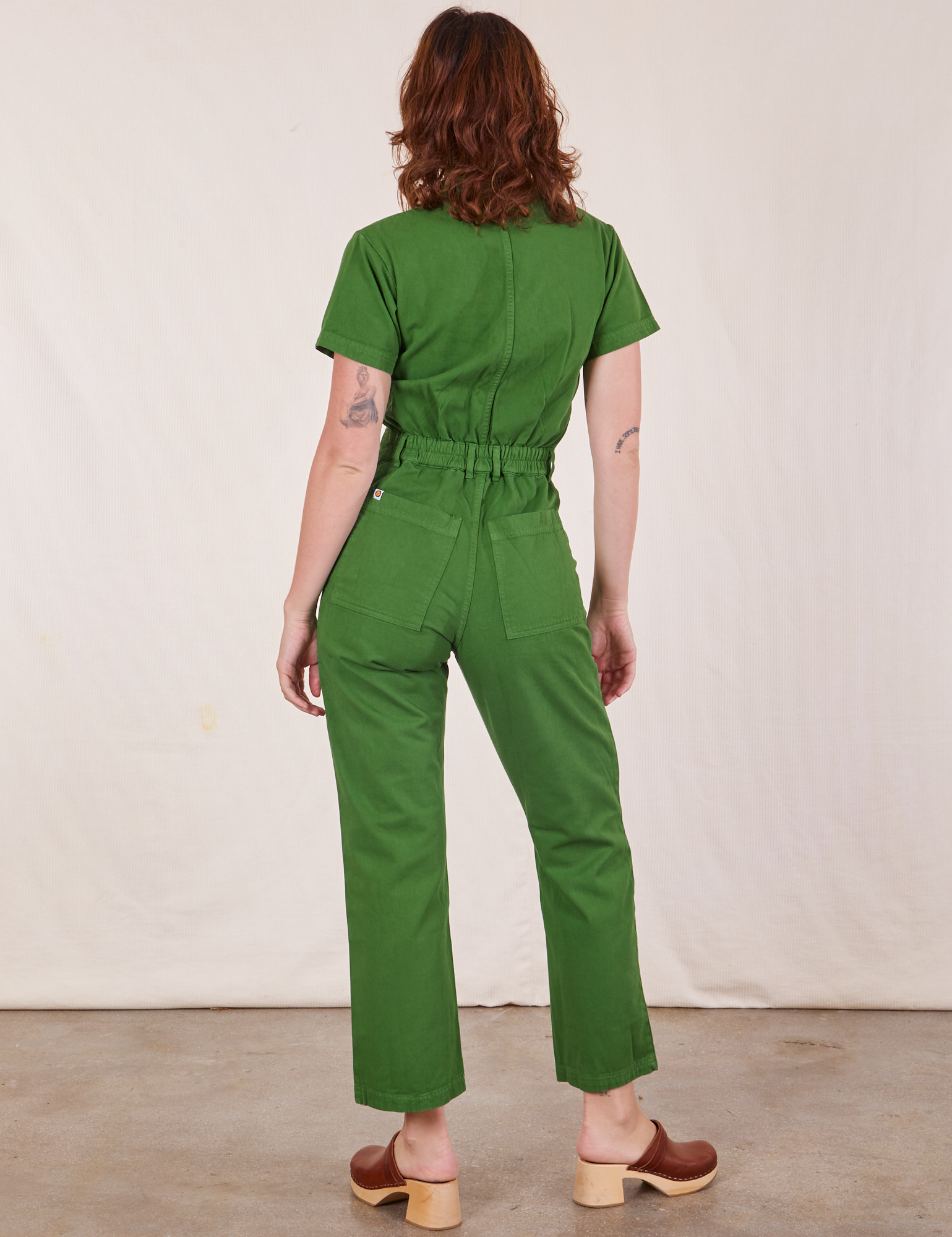 Back view of Short Sleeve Jumpsuit in Lawn Green worn by Alex