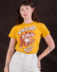 Alex is wearing Wicker Park Tourist Tee tucked into vintage tee off-white Western Pants
