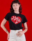 Alex is wearing I love LA Tourist Tee tucked in vintage tee off-white Western Pants