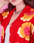 Paintstamped Pantry Button-Up in Mustang Red close up on Alex