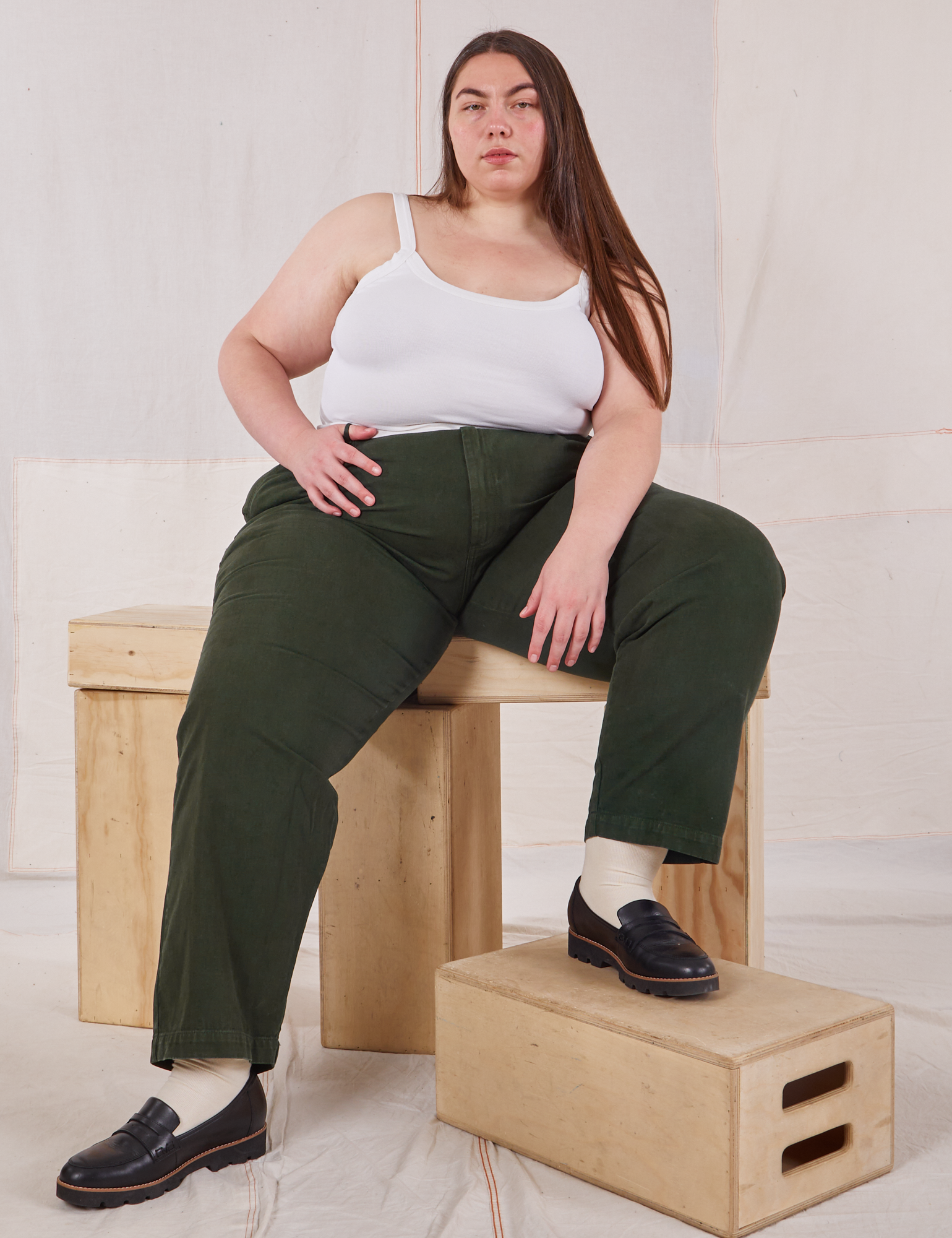 Marielena is wearing Heavyweight Trousers in Swamp Green and Cropped Cami in  vintage tee off-white