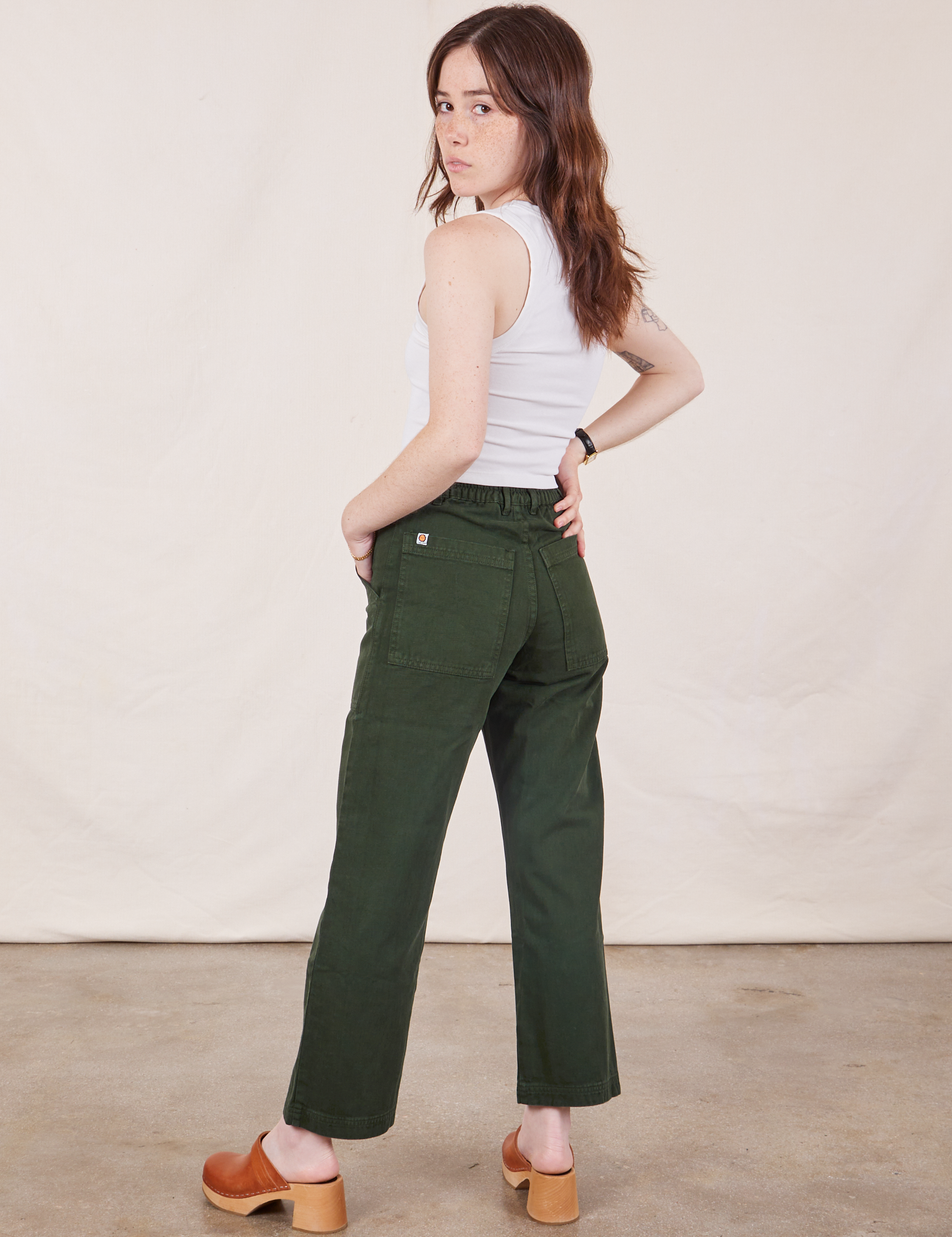 Back view of Petite Work Pants in Swamp Green and vintage tee off-white Cropped Tank