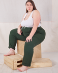 Marielena is wearing Rolled Cuff Sweat Pants in Swamp Green and Cropped Tank in vintage tee off-white