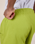 Sweat Shorts in Gross Green back close up on Isaac