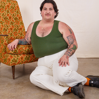 Tank Top in Dark Emerald Green on Sam wearing vintage off-white Western Pants