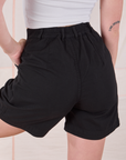 Trouser Shorts in Basic Black back close up on Alex