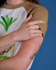 Produce Raglan Tee in Onion sleeve close up on Alex