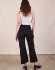 Back view of Western Pants in Basic Black and Cropped Cami in vintage tee off-white on Alex