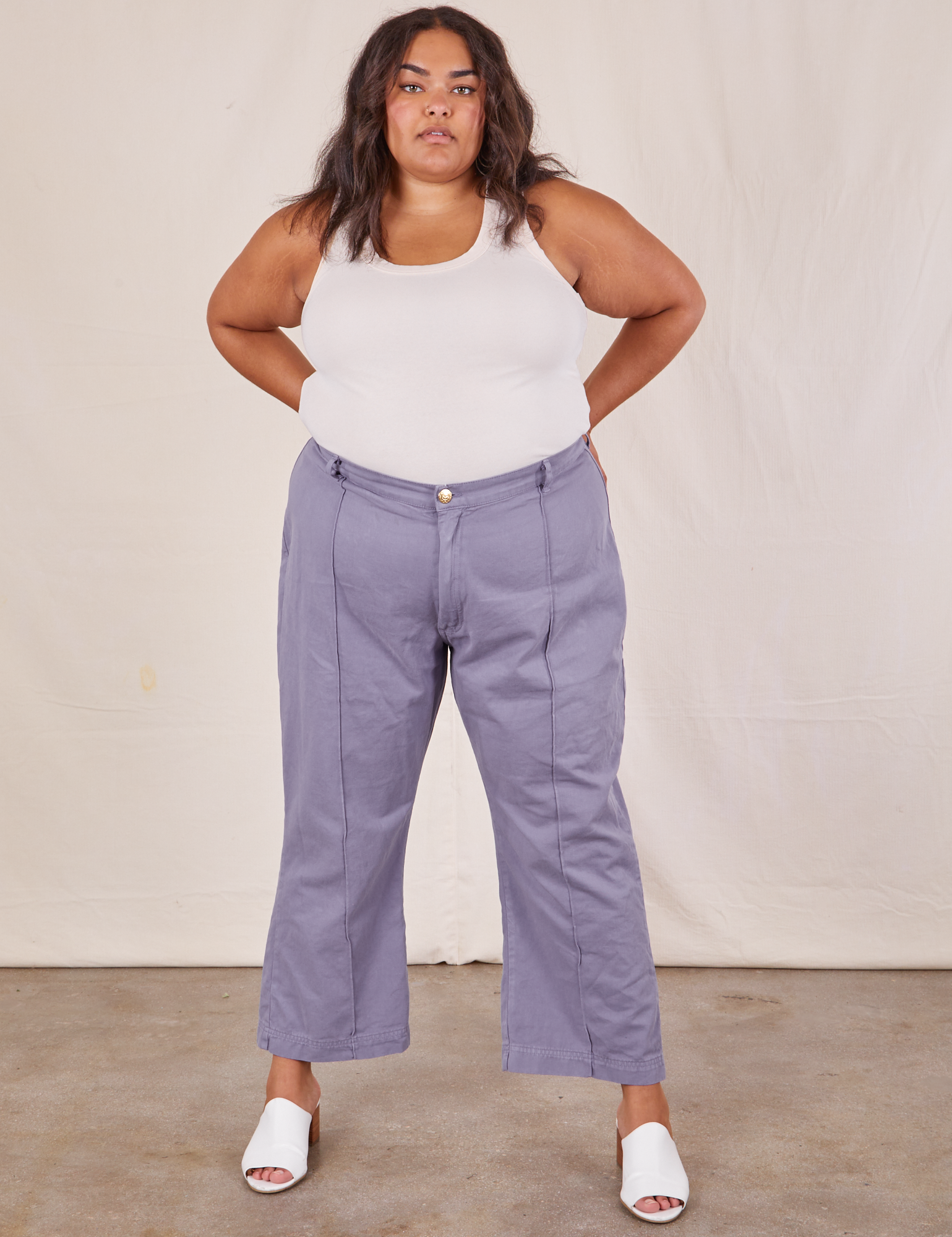 Alicia is 5&#39;9&quot; and wearing 2XL Western Pants in Faded Grape paired with a Tank Top in vintage tee off-white