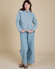 Indigo Denim Work Jacket in Light Wash and light wash Indigo Wide Leg Trousers on Alex