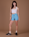 Alex is 5’8” and wearing XXS Classic Work Shorts in Baby Blue paired with vintage off white Cropped Tank