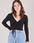 Hana is 5'3" and wearing size 1 Wrap Top in Basic Black