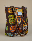 Angled front view of Halloween Masks Shoulder Zip Tote
