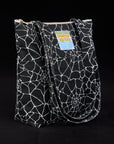Angled view of Spider Webs Printed Shoulder Zip Tote