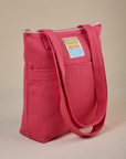 Angled view of Over-Shoulder Zip Mini Tote in Hot Pink