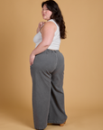 Angled back view of Heritage Wide Leg Trousers in Washed Grey on Ashley