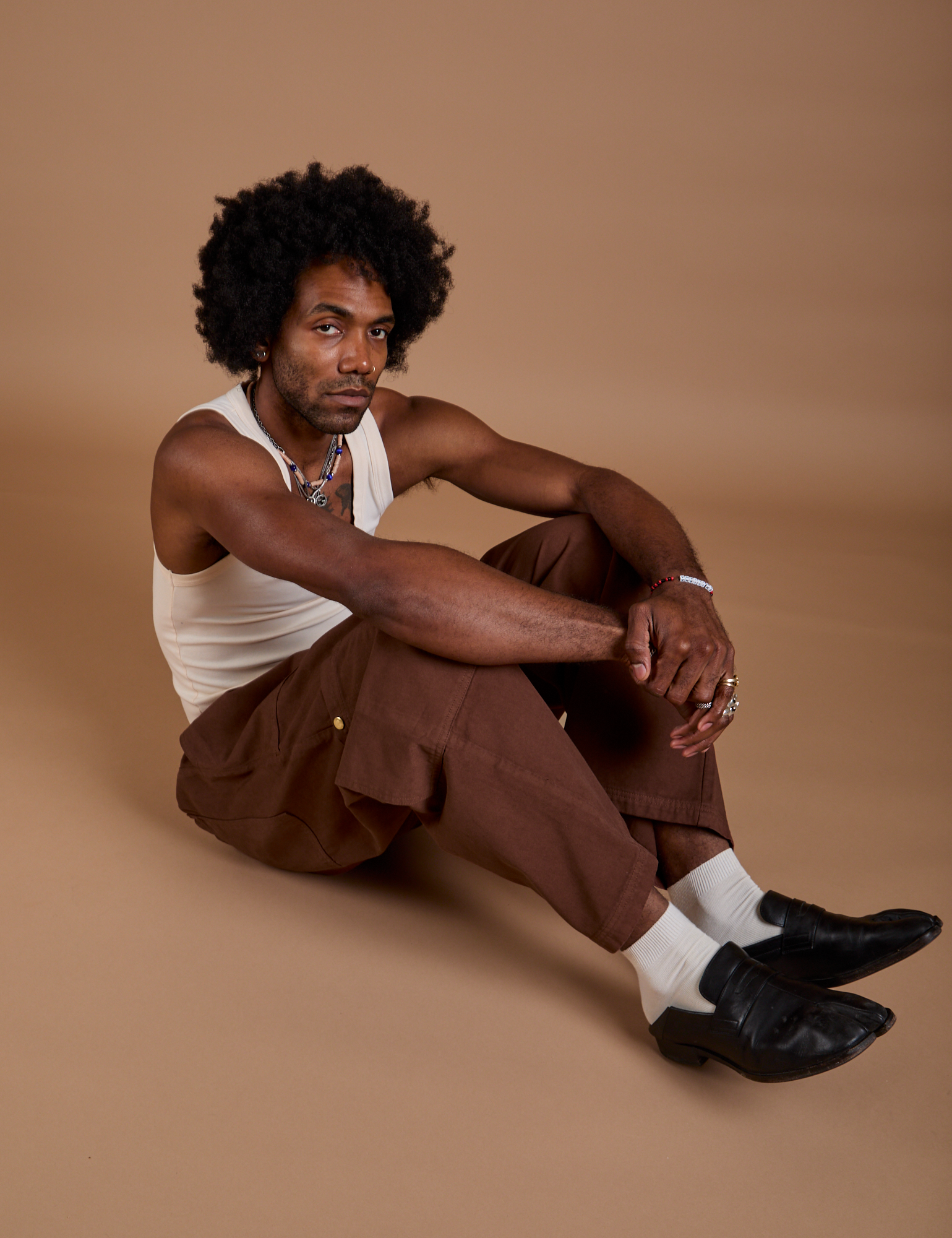 Jerrod is wearing Drop Pocket Cargo Pants in Fudgesicle Brown