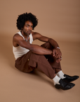 Jerrod is wearing Drop Pocket Cargo Pants in Fudgesicle Brown