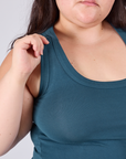 Close up of Ashley holding onto the strap of Cropped Tank Top in Lagoon