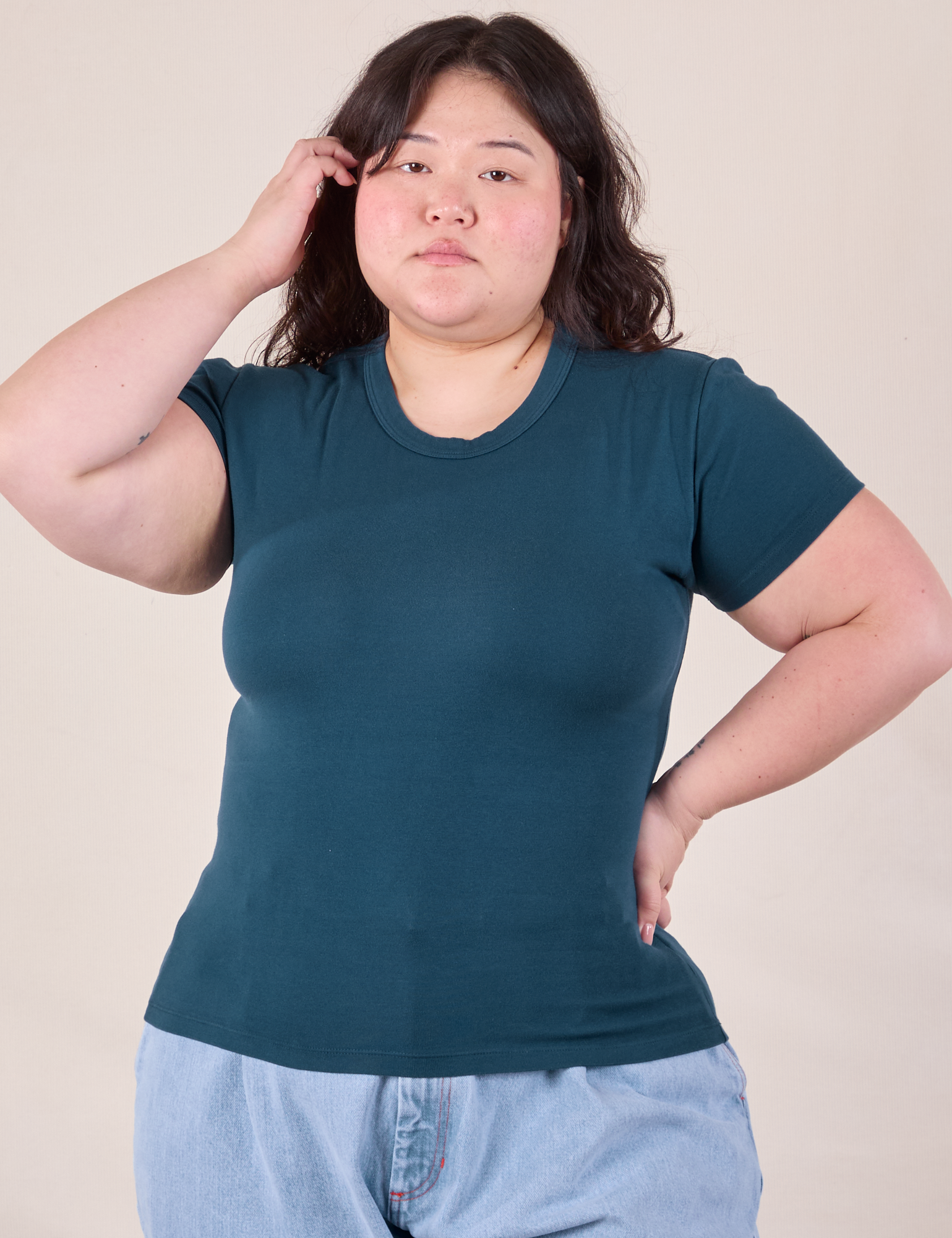 Ashley is 5'7" and wearing L Baby Tee in Lagoon