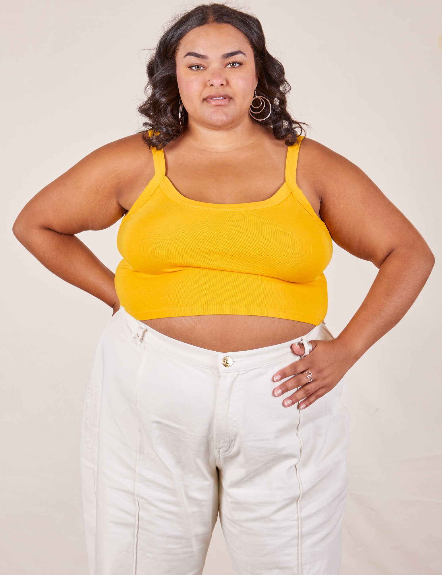 Alicia is 5&#39;9&quot; and wearing XL Cropped Cami in Sunshine Yellow paired with vintage off-white Western Pants