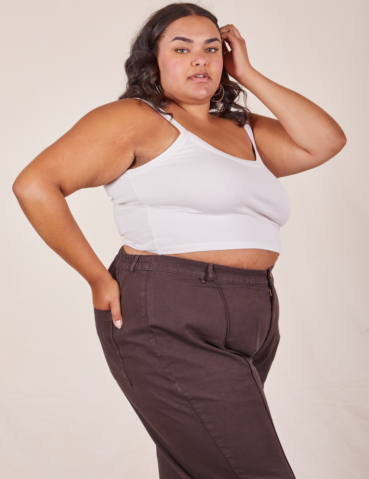 Side view of Cropped Cami in Vintage Tee Off-White and espresso brown Western Pants worn by Alicia