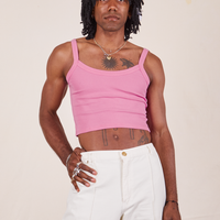 Jerrod is 6'3" and wearing S Cropped Cami in Bubblegum Pink paired with vintage off-white Western Pants