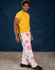 Side view of Paintstamped Work Pants in Bubblegum and sunshine yellow Organic Vintage Tee
