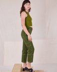 Side view of Railroad Carpenter Jeans in Summer Olive and Muscle Tee on Alex