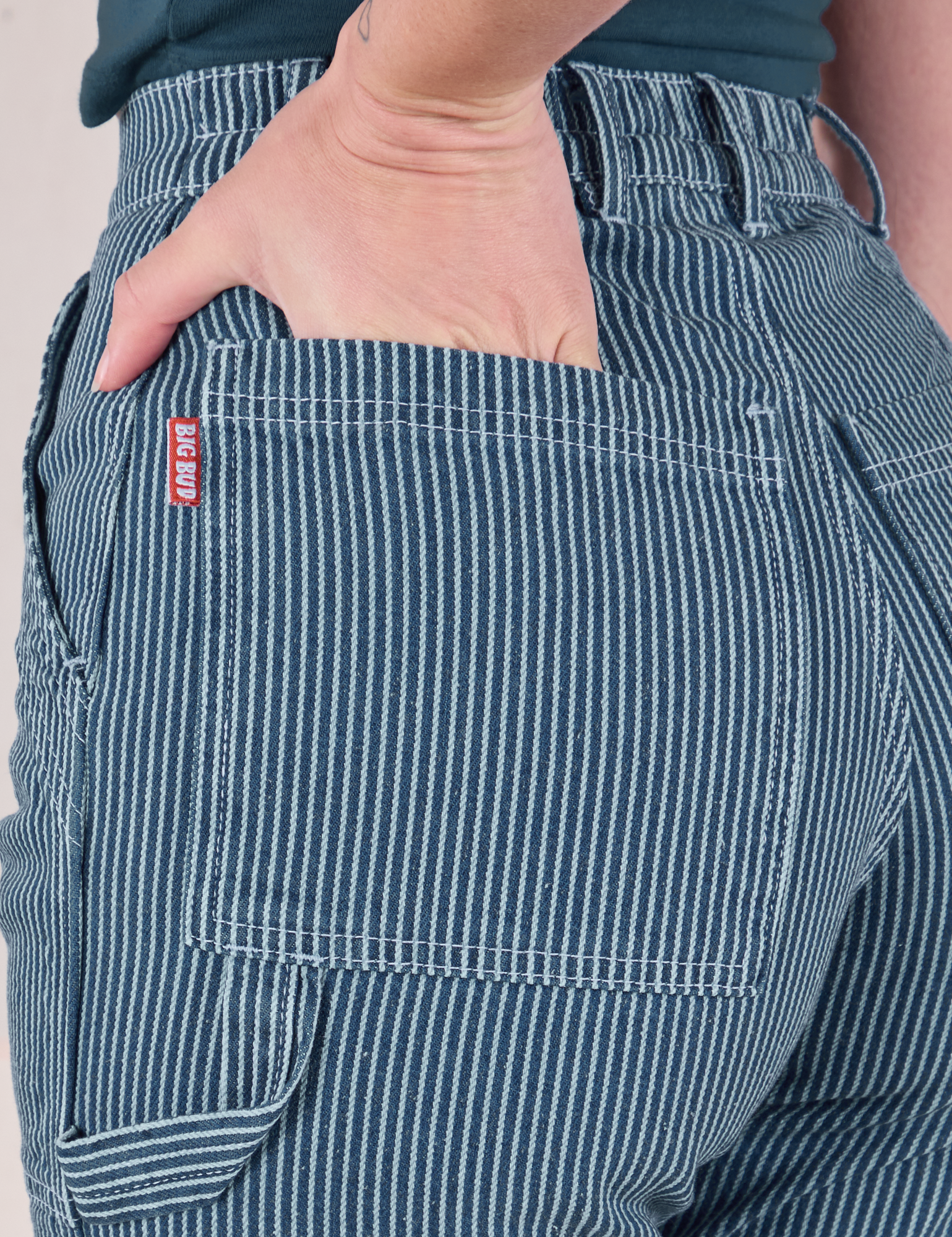 Close up of Alex's hand in the back pocket of Railroad Carpenter Jeans in Baby Blue