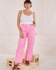 Tiara is 5'4" and wearing S Carpenter Jeans in Bubblegum Pink paired with Cropped Cami in vintage tee off-white