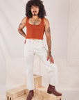 Jesse is 5'8" and wearing XS Carpenter Jeans in Vintage Tee Off-White paired with burnt terracotta Cropped Tank Top