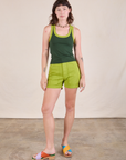 Alex is wearing Colorblock Cropped Tank in Swamp Green and gross green Work Shorts