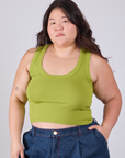 Ashley is 5'7" and wearing L Cropped Tank Top in Gross Green