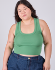 Ashley is 5'7" and wearing L Cropped Tank Top in Seafoam Green