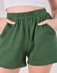 Easy Shorts in Dark Emerald Green front close up on Alex