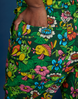 Close up of Kandia's hand in the back pocket of Pond Party Print Jumpsuit