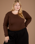 Juliet is 5’7” and wearing L Long Sleeve Baby Tee in Fudgesicle Brown