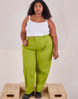 Morgan is 5'5' and wearing 1XL Heavyweight Trousers in Gross Green paired with Cami in vintage tee off-white