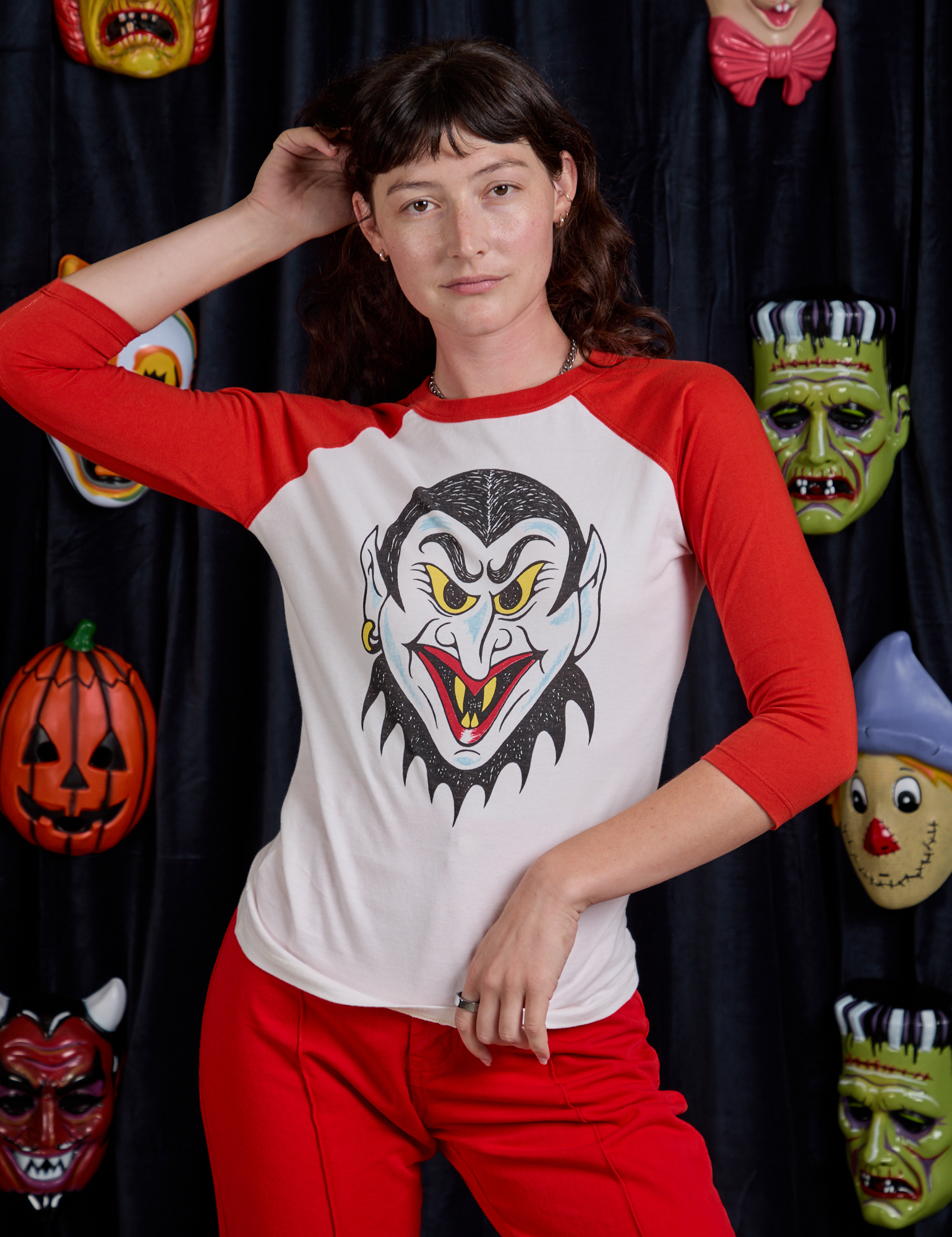 Alex is 5'8" and wearing P Raglan Tee in Dracula