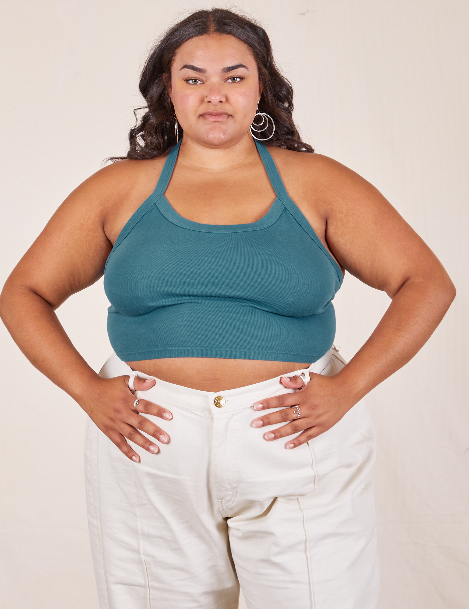 Alicia is 5&#39;9&quot; and wearing XL Halter Top in Marine Blue paired with vintage off-white Western Pants